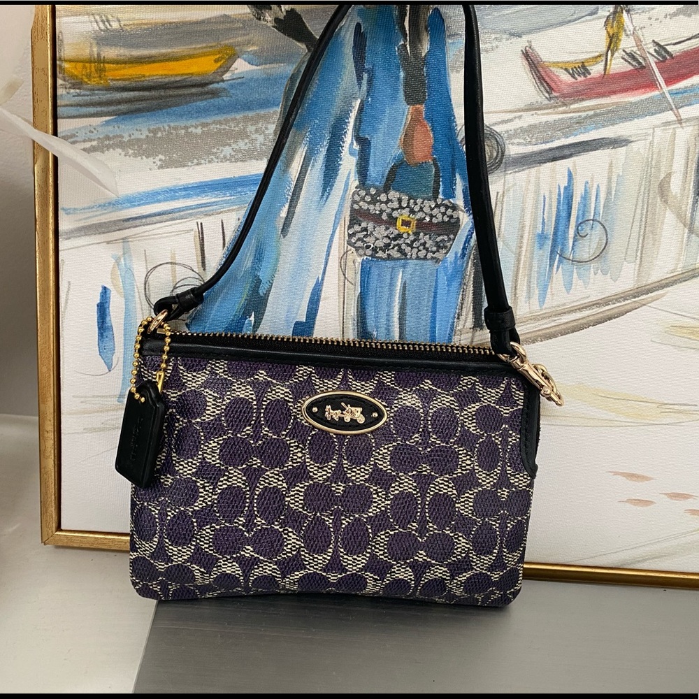 Dark purple Coach wristlet